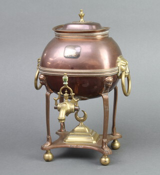 A Regency copper and brass tea urn with ring drop handles, raised on bun feet 30cm h x 20cm w x 16cm d 