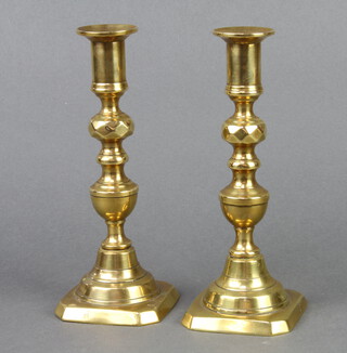 A pair of 19th Century brass candlesticks with knopped stems and ejectors 20cm h x 8cm x 8cm 