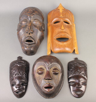 A Cmoii-Chokwe style tribal mask together with 4 others 