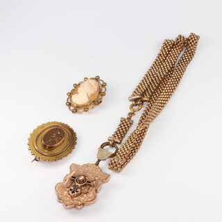 A Victorian gilt etruscan style brooch, a ditto cameo and a pendant on chain  