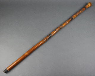 A Chinese carved bamboo walking stick decorated 4 portraits and signed to the base 89cm l 