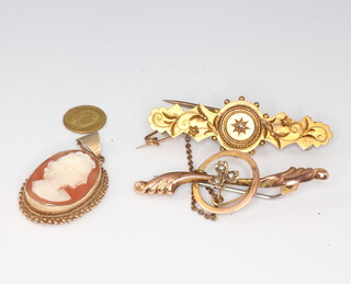 Two Victorian bar brooches - one 15ct gross weight with pin 3.3 grams, the other 9ct gross weight with pin 1.4 grams, a Mexican 1865 coin 0.3 grams and a 9ct mounted cameo brooch 