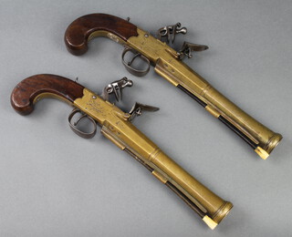 Joseph Bunney, a pair of brass barrelled Blunderbuss flintlock box lock pistols with 11cm circular barrels, brass barrels marked Bunney London and with Tower Private proof marks with steel lock and original horn and steel ram rods, engraved steel trigger guard 33cm overall 