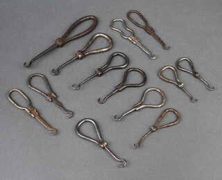 13 various 19th Century polished steel folding button hooks 