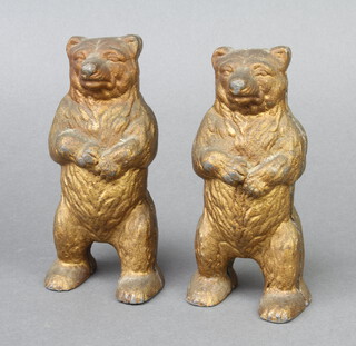 A pair of gilt painted cast metal money boxes in the form of standing bears 16cm h x 4cm w x 7cm d 