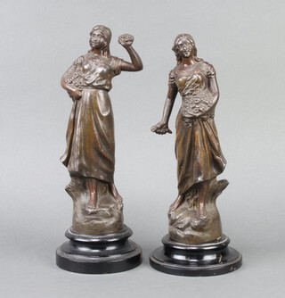 A pair of 19th Century spelter figures of standing ladies depicting seasons, raised on socle bases 34cm h x 13cm d 