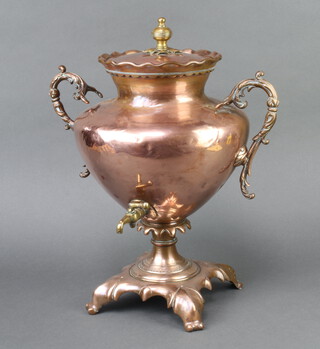 A copper and brass twin handled Samovar raised on panelled supports 49cm h x 35cm 