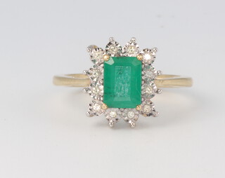 A 9ct yellow gold rectangular emerald and diamond cluster ring the centre stone 1.03ct, the illusion set diamonds approx. 0.06ct, 2.9 grams, size K 1/2