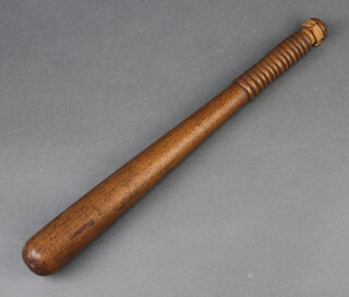 A War Department turned truncheon with broad arrow marked WD 39cm 