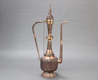 A large and impressive pierced copper and brass Turkish style coffee pot 133cm h x 33cm 