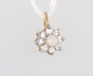 A 9ct yellow gold opal and paste set daisy pendant 0.6 grams, 11mm 