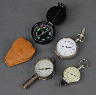 A foreign map mileage recorder, the reverse set a compass, a French compass with paper dial incorporating a mirror and magnifying glass, a pedometer and a small compass 