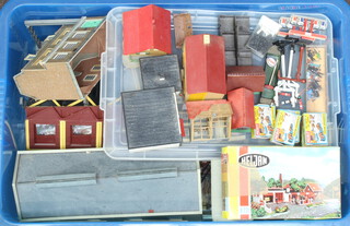 A box of Merit OO gauge station accessories together with various paper and plastic railway buildings 
