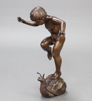 A 20th Century bronze fountain in the form of a naked boy standing on a large snail 69cm h x 50cm w x 28cm d  