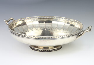 A silver 2 handled shallow bowl with pierced rim and scroll handles, London 1923, 652 grams, 23cm 