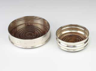 A silver coaster with hardwood base, London 1979, 9.5cm, a ditto London 1998 12.5cm 
