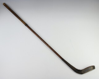 A hickory shafted, unmarked, golf club  
