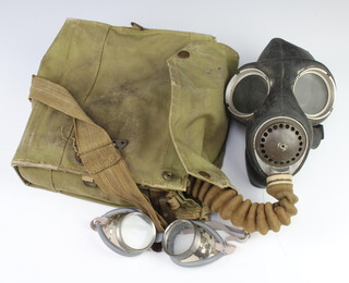 A military issue respirator and case, the case marked 1940 together with a pair of goggles marked GS Din 27 (1 lens cracked) 