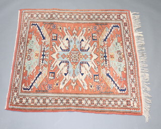 A Caucasian style tan, white and green rug with central medallion and multi row border 149cm x 133cm 