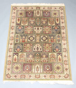 A machine made blue and brown ground Persian style rug formed of numerous panels 196cm x 143cm 