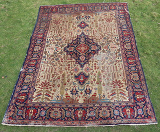 A sand and blue ground Tabriz carpet with central medallion within multi row border 385cm x 280cm 
