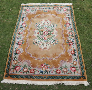A yellow ground and floral patterned Chinese carpet 280cm x 186cm 
