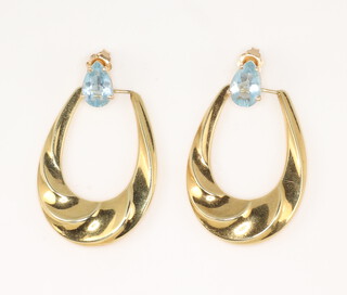 A pair of yellow metal aquamarine half hoop earrings, 5.2 grams