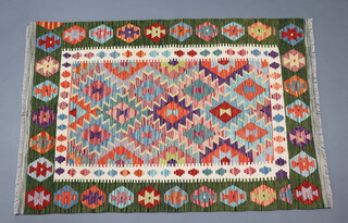 A green, white and tan ground Chobi Kilim runner with all over geometric design 150cm x 103cm 