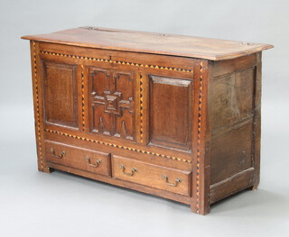 A 17th/18th Century oak mule chest of panelled construction with hinged lid, the base fitted 2 long drawers with brass drop handles 83cm h x 137cm w x 55cm d 