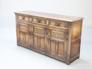 An Ipswich style carved oak dresser base fitted 3 drawers above triple cupboard with arcaded decoration 85cm h x 158cm w x 34cm d 