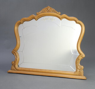 A Victorian style etched and cut glass over mantel mirror contained in a carved walnut frame 81cm h x 97cm w x 5cm d 