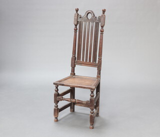 A Victorian, 17th Century style oak hall chair with stick and rail back and solid seat, raised on turned supports 119cm h x 46cm w x 37cm d (seat 30cm x 24cm)  
