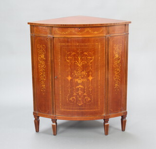 Edwards and Roberts, an Edwardian inlaid mahogany and crossbanded corner cabinet, the upper section fitted a drawer, the base enclosed by a panelled door raised on square tapered supports 92cm h x 80cm w x 53cm d 