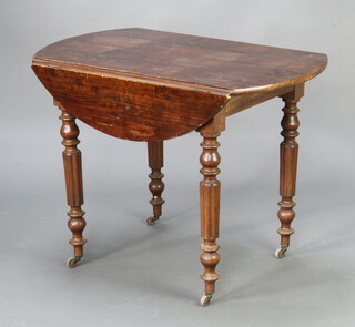 A 19th Century oval Continental beech Pembroke table raised on turned and fluted supports 76cm h x 99cm w x 60cm when closed x 100cm when open 