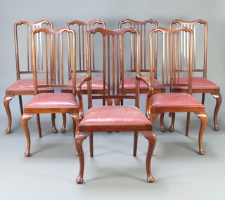 A set of 7 1930's Queen Anne style mahogany stick and rail back dining chairs with upholstered drop in seats, raised on cabriole supports, 1 carver 111cm h x 55m w x 47cm d (seat 26cm x 28cm), 6 standard 104cm h x 47cm w x 43cm (seat 27cm x 28cm)   