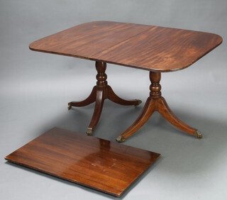 A Georgian style mahogany D end extending dining table with 1 extra leaf, raised on pillar and tripod supports with brass paw feet 72cm h x 98cm wide x 136cm l x 193cm when extended 