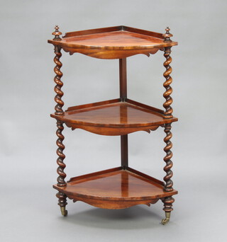 A Victorian mahogany bow front 3 tier corner what-not with 3/4 gallery, raised on spiral turned supports with turned feet 96cm h x 46cm w x 46cm d  