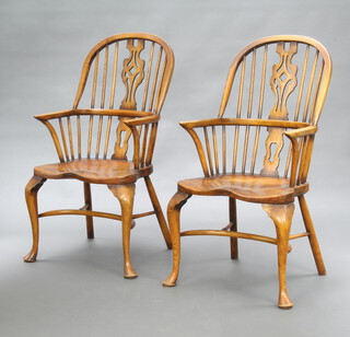 A pair of 18th Century style elm Windsor carver chairs with shaped slat backs and solid seats, raised on cabriole supports with crinoline stretcher  106cm h x 51cm w x 41cm d (seat 33cm x 30cm) 