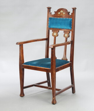 An Art Nouveau Liberty's style painted oak slat back carver chair with arch shaped back upholstered in blue material with upholstered drop in seat, raised on square supports with H framed stretcher 110cm h x 58cm w x 48cm d (seat 32cm x 31cm) 