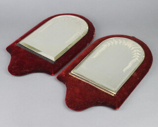 A pair of Victorian arch shaped bevelled plate mirrors with etched vinous decoration, contained in a red plush frames 36cm h x 21cm w  