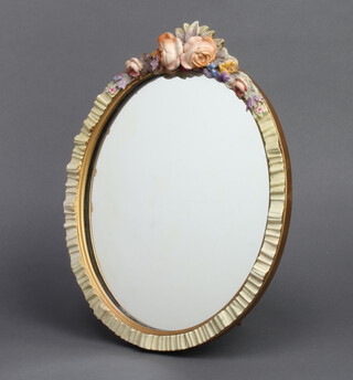 A 1930's oval plate easel mirror contained in a barbola rose mounted frame 34cm x 26cm  