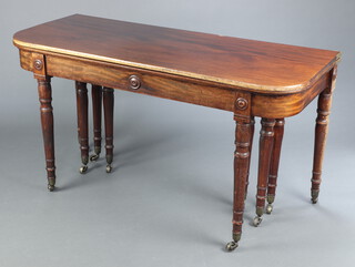 A Wilkinson Moorfield Patent Regency mahogany  concertina action extending dining table, the apron carved roundels, raised on 10 turned supports ending in brass caps and casters, the action impressed Wilkinson Moorfields Patent 360 and the cross stretchers marked Wilkinson Moorfields Patent 360 in several places, the 4 leaves are marked 360 to the underside 73cm h x 137cm wide x 114cm l without the leaves x 326cm when fully extended, complete with 10 brass clips  