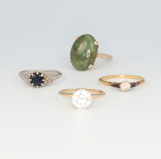 A white metal gem set ring, 3 yellow metal gem set rings, gross weight 14.4 grams sizes M