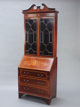 An Edwardian inlaid mahogany bureau bookcase the upper section with shaped cornice and pediment, the interior fitted adjustable shelves enclosed by astragal glazed panelled doors, the fall front revealing a fitted interior above 3 long drawers, raised on bracket feet 213cm h x 76cm w x 45cm d 