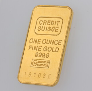 A 31 gram (1 ounce) Credit Suisse fine gold 999.9 ingot, numbered 191085 together with Credit Suisse assay certificate 