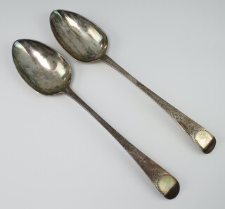 A pair of George III silver table spoons with bright cut decoration London 1803, 102 grams 