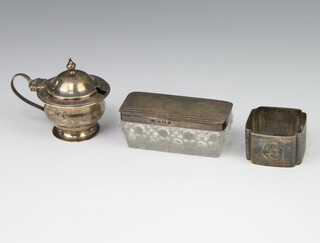 A silver mounted toilet box Sheffield 1915, a mustard and napkin ring 90 grams 