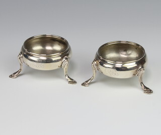 A pair of George IV silver table salts with hoof feet London 1828 Maker HB