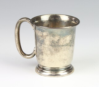A silver christening mug with C scroll handle Sheffield 1954 8cm, 94 grams