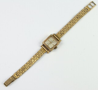 A lady's 9ct yellow gold Accurist wristwatch contained in a 9ct case on a gilt bracelet 